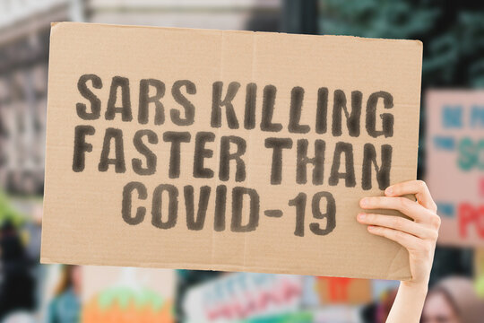 The phrase " SARS killing faster than COVID-19 " on a banner in men's hand with blurred background. Protest. Police. Nigeria. Anger. Aggression. Conflict. Violation. Confrontation