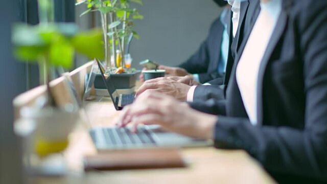 new normal lifestyle concept business people wearing mask sit with social distancing working in public area or co working space with laptop and smartphone