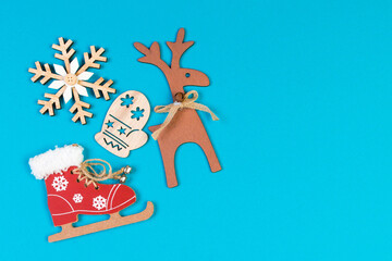 Top view of festive composition made of New Year decorations on colorful background. Merry Christmas concept with empty space for your design