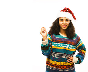 cute young real african hipster girl in santas red hat isolated on white background waiting for winter Christmass