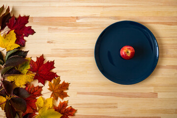 autumn still life, apple on a plate
