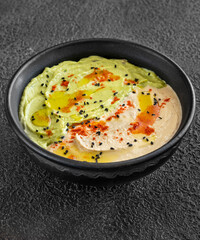 Obraz na płótnie Canvas Bowl of guacamole and hummus