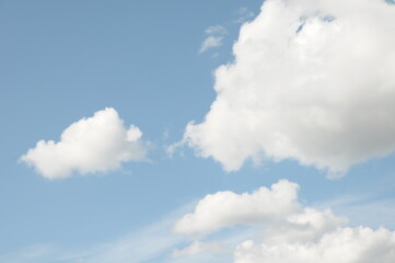 Naklejka na ściany i meble white fluffy clouds in blue sky