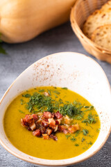 Tasty pumpkin soup in a bowl. Closeup