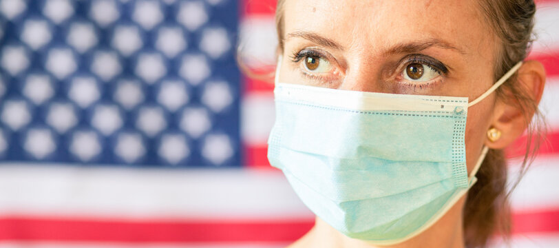 Woman Wearing Mask In Front Of USA Flag Elections During Covid