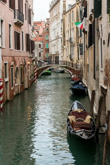 Fototapeta na wymiar Canale (water canal) with traditional gondola boat in Venice (Venezia), Italy, Europe