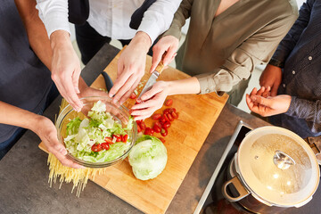 Prepare fresh vegetarian salad together for lunch
