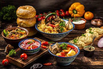 Uzbek and Central Asia cuisine concept. Assorted Uzbek food pilaf samsa lagman manti shurpa Uzbek restaurant concept Uzbek food. Food recipe background.