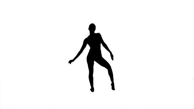 Silhouette. Professional dancer performs over white background.