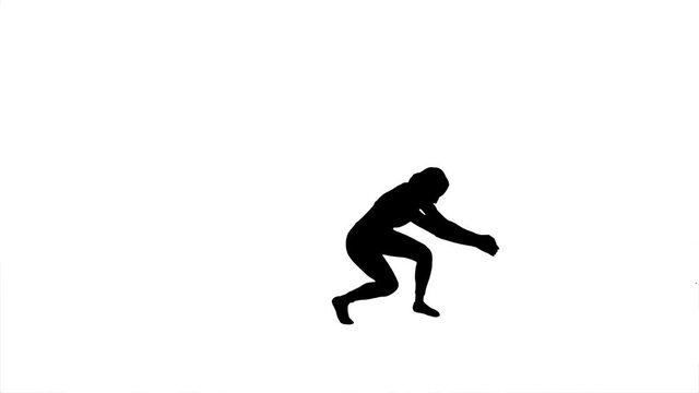 Silhouette. Professional dancer performs a choreographed dance over white background.