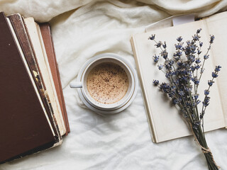 Old books and white cup of coffee 