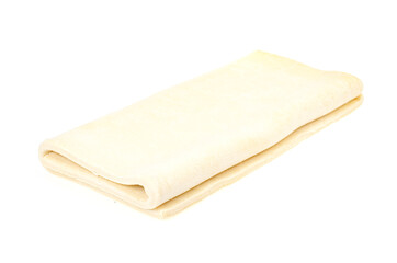 Folded plate raw dough on white background.
