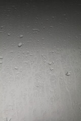 Water droplets on the hood after rain on a stormy day reflected in the gloomy sun all day on warm cold evenings. Quiet and lonely, scary
