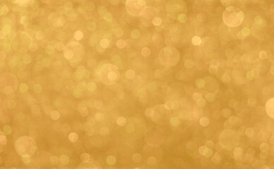Gold light shiny bokeh abstract blur background with bright round defocus golden pattern, can use for Christmas festive decoration and any design
