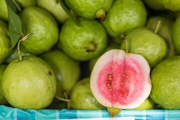 Fresh guava fruit. Green background.