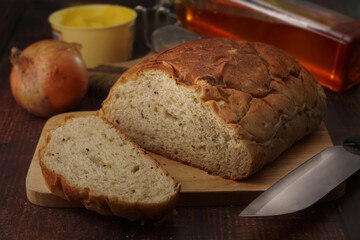 Whole wheat onion bread on wooden chop. Nutrition fact and clean food good taste ideas concept. Selective focus and free space for text.