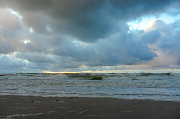 Sea coast. Tides and storms at sea. Waves on the Baltic Sea. Deserted seashore.