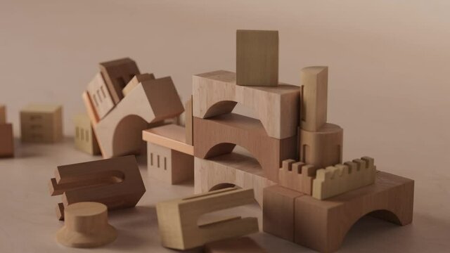 3d render of abstract castle. 3d render of wooden toy blocks structured in castle figure. Time reverse demolition animation.