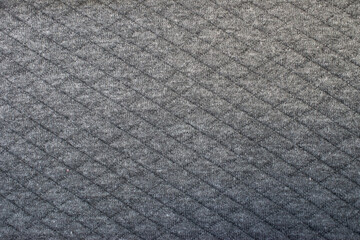background from a texture of clothes with a gray gradient. embroidered sweatshirt