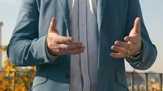 Close-up of a man's hands gesturing and waving conveying emotions during a conversation. Gestures with men's hands