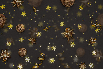 Black Christmas and New Year background with sparkling golden decorations. Christmas party background.