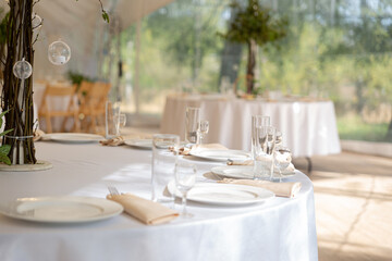 Table setting element empty plates with cutlery on white tablecloth