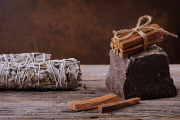 Dried white sage smudge sticks and palo santo smudging sticks.