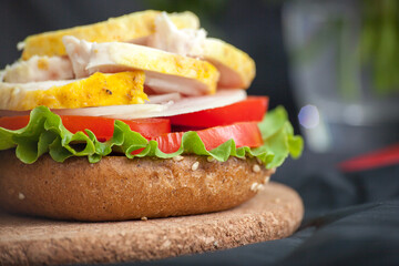 Burger with chicken on a dark background