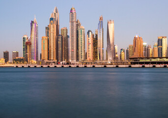 Fototapeta na wymiar View of A Dubai Marina after sunset. Shot made from Palm Jumeirah, man made island. Dubai, UAE.