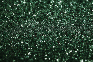 Green glitter texture  sparkling shiny wrapping paper background for Christmas holiday decoration, greeting and wedding invitation card design element, Xmas abstract background with copy space