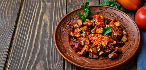 Grilled Turkish eggplants in tomato sauce (soslu patlican or şakşuka.). A tasty and simple Turkish dish or appetizer for main courses. Close-up with copy space