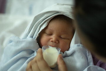 New Born Baby Girl  Drinking Milk from Cup