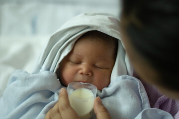 New Born Baby Girl  Drinking Milk from Cup