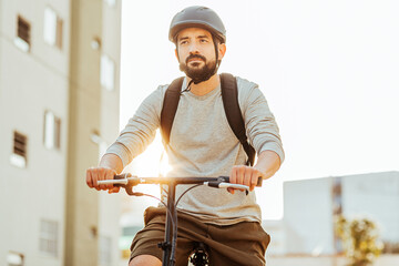 Male cyclist riding in the city.