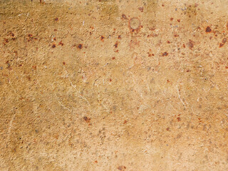 Light brown with streaks of a rusty wall of the garage.
