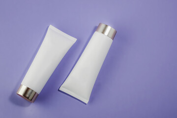 Blank plastic Cosmetic tube mockup as package for cream or lotion on light purple background