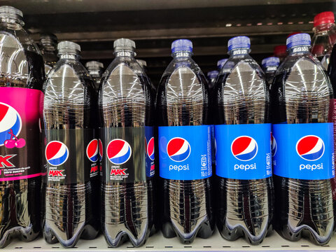 Pepsi Cola Soft Drink Bottle's On The Supermarket Shelf In Hypermarket