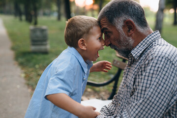 boy with his grandfather in park