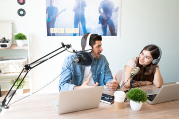 Radio cohosts talking and communicating