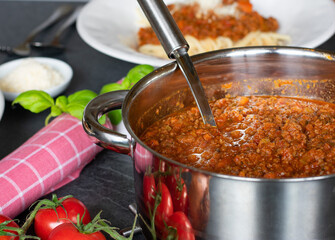 pot of bolognese sauce on a kitchen table ready to eat