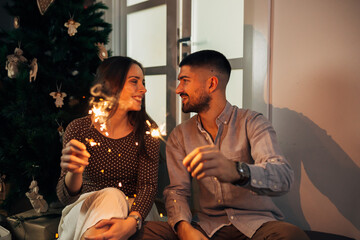 romantic couple celebrating new years eve at home