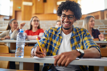 Male student enjoying at the lecture