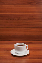 Coffee cup top view on wooden table background