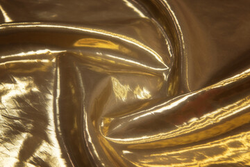 Close-up of gold leather sofa upholstery with square background texture