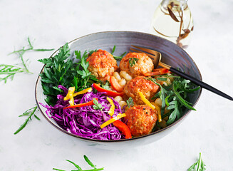 Italian pasta. Cavatappi with meatballs and salad on dark background. Dinner. Slow food concept