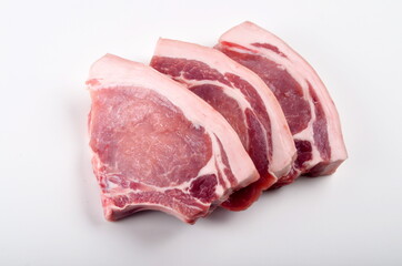 Sliced raw pork steak isolated on white background. Top view