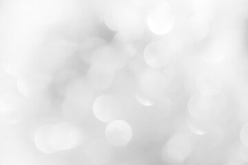 A brilliant white background with circles and ovals. Template for a holiday card with bright and sparkling lights.