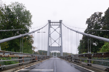 Kingston, NY / United States - Oct.13, 2020: Landscape image of The Kingston–Port Ewen Suspension Bridge also known as the Wurts Street Bridge is a steel suspension bridge spanning Rondout Creek.
