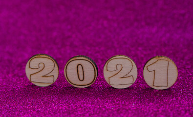 Obraz na płótnie Canvas Happy New Year 2021. Wood text on shiny background. Perfect for your invitation or office postcard