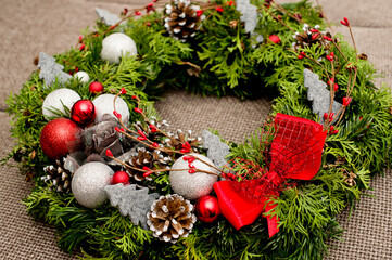 Festive background with an Advent wreath. Christmas lights. Handmade decoration.